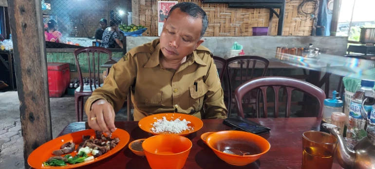 Indonesian civil servant Silas Sihombing has been eating dog meat since he was a child [Courtesy of Aisyah Llewellyn]